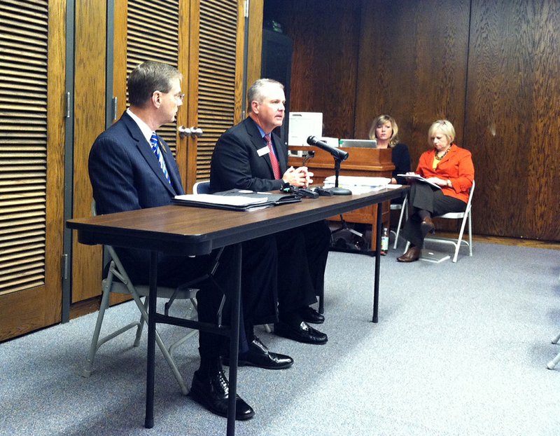 Arkansas Department of Education Commissioner Tom Kimbrell, at the microphone, and Greg Murry, the Conway School District superintendent, release Monday, Nov. 19, 2012, the 2012 school-accountability reports.