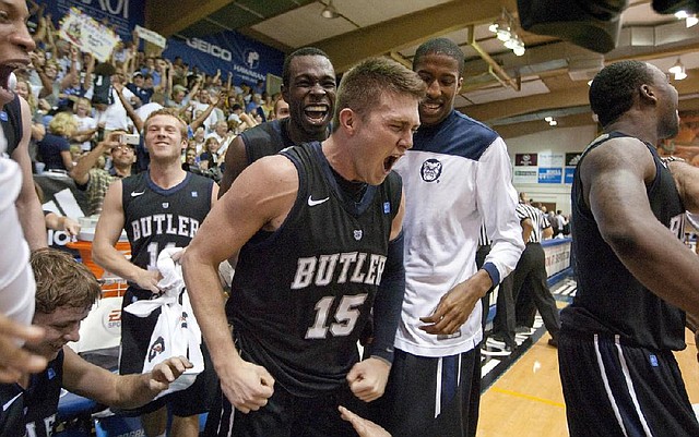 Butler guard Rotnei Clarke (15) made a 22-foot three-pointer at the buzzer to lead the Bulldogs to a 72-71 victory over Marquette on Monday at the Maui Invitational in Lahaina, Hawaii. Clarke, a former Arkansas Razorback, made just 4 of 14 three-pointers in the game and finished with 20 points. 