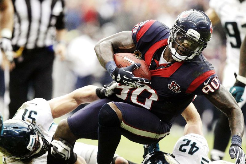 Houston Texans wide receiver Andre Johnson set career highs with 14 receptions for 273 yards in the Texans’ 43-37 victory over the Jacksonville Jaguars in overtime Sunday in Houston. 