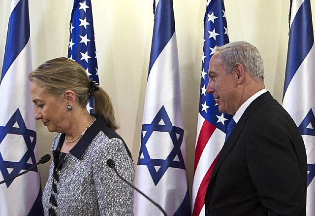 Secretary of State Hillary Rodham Clinton and Israeli Prime Minister Benjamin Netanyahu end a news conference Tuesday in Jerusalem after a late-night meeting on an Israeli-Hamas cease-fire. 