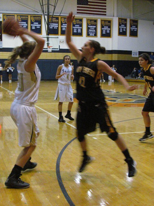 Prairie Grove's Whitnee Fitts, right, defends Shiloh Christian's Cayden Sears during Tuesday night's nonconference game.