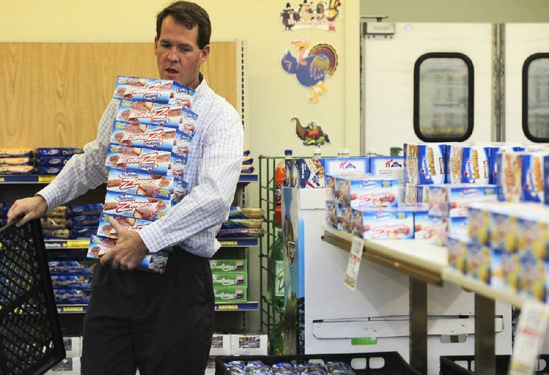 Scott Hubbard of Chico, Calif., loads Hostess Zingers at the Hostess store in Redding, Calif., on Friday. 