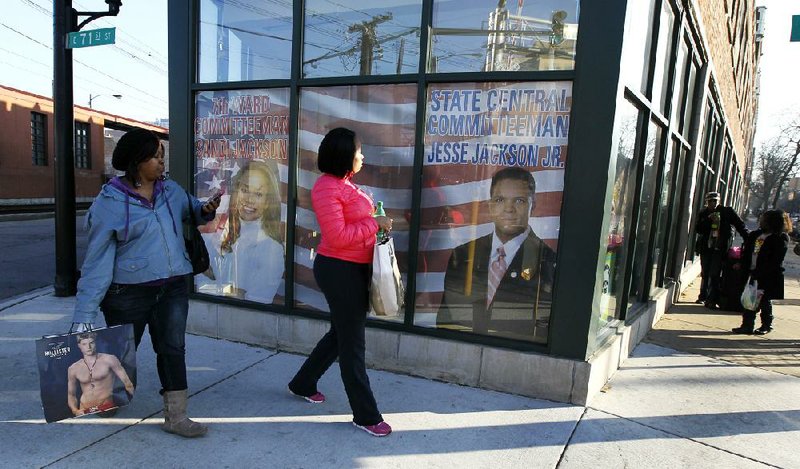 Chicagoans on Wednesday walk past the shared offices of Alderman Sandi Jackson and her husband, former U.S. Rep. Jesse Jackson Jr. 