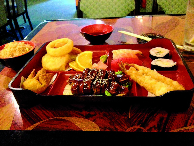 Steak Teriyaki comes with tempura vegetables, a “crabmeat” puff and, like many dishes at Igibon Japanese Food House, orange slices for accent. 