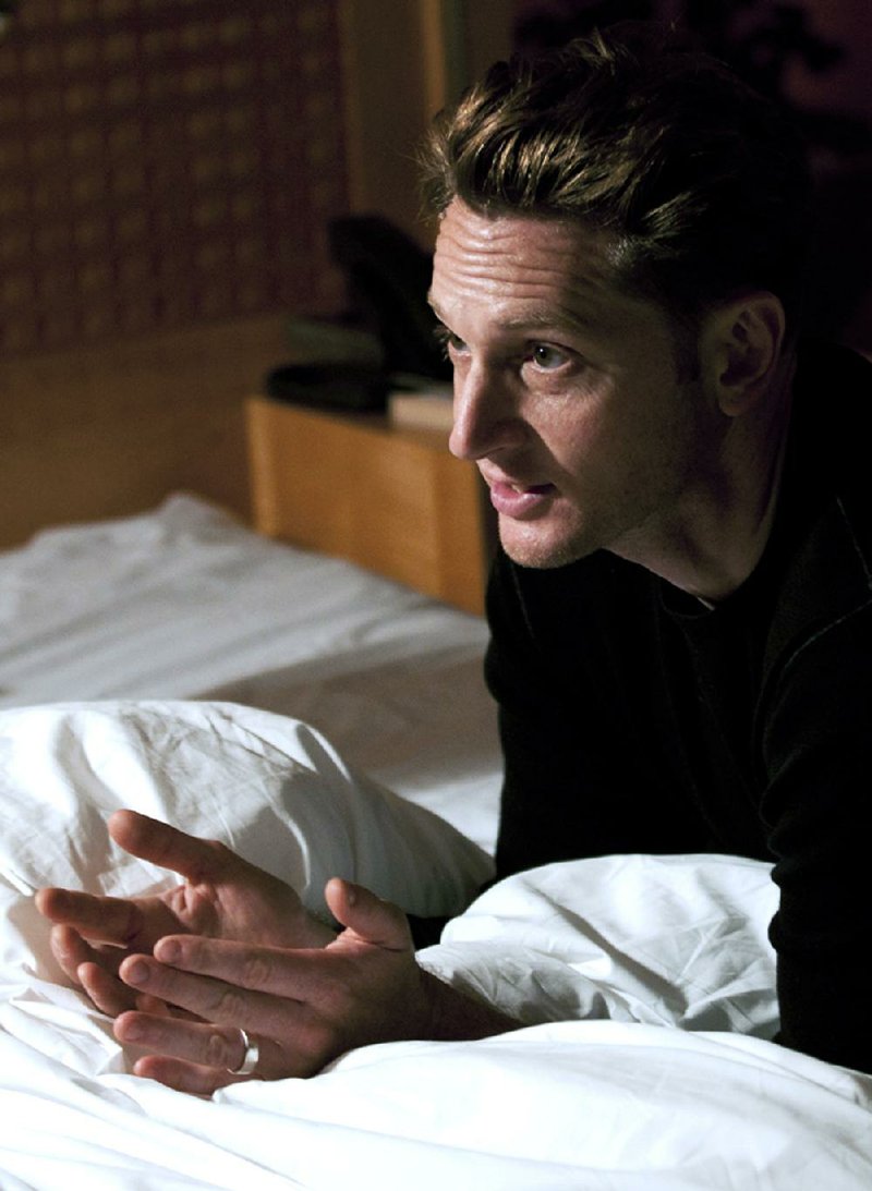 We’re showing you this picture of 28 Hotel Rooms director Matt Ross making a point to his cast at L’Ermitage Beverly Hills because all of the other available promotional photos contained naked bodies. 