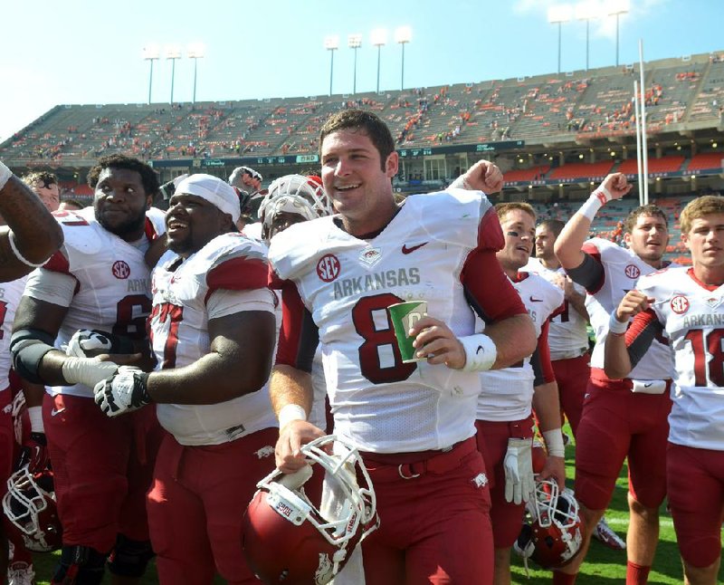 Gene Chizik’s Auburn Tigers had all the momentum from a national championship season and the accompanying exposure, and stockpiled highly rated recruits to keep the success going. The Tigers were beaten 24-7 by a struggling Razorbacks team and then things got even worse. Shown University of Arkansas quarterback Tyler Wilson celebrates with his team following the Razorbacks win over Auburn.