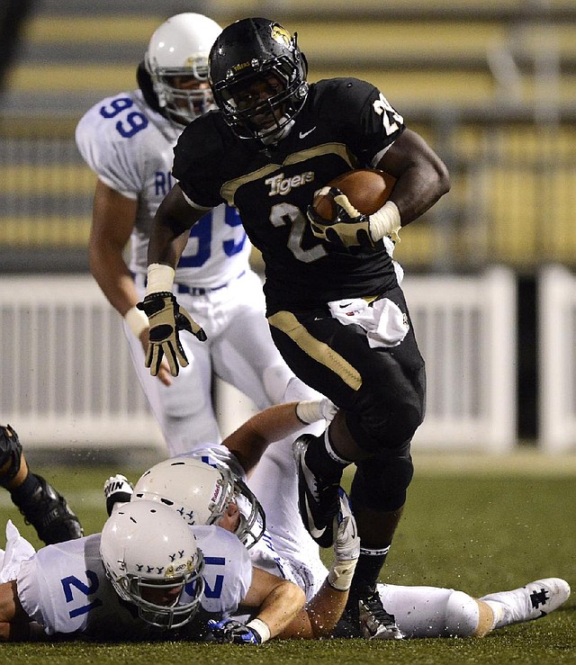 Bentonville running back Tearris Wallace (29) has rushed for 4,453 yards for the top-ranked Tigers, who have won 35 consecutive regular-season games. 