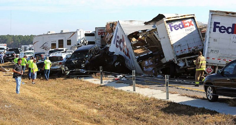 Wrecked vehicles litter Interstate 10 in southeastern Texas after Thursday morning’s pileup. 