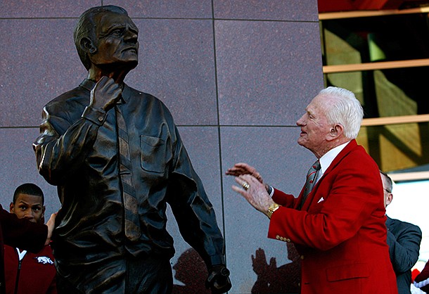 NWA Media/JASON IVESTER -- Frank Broyles admires the statue representing him during an unveiling ceremony outside the Broyles Athletic Center on Friday, Nov. 23, 2012, at Donald W. Reyonlds Stadium in Fayetteville.