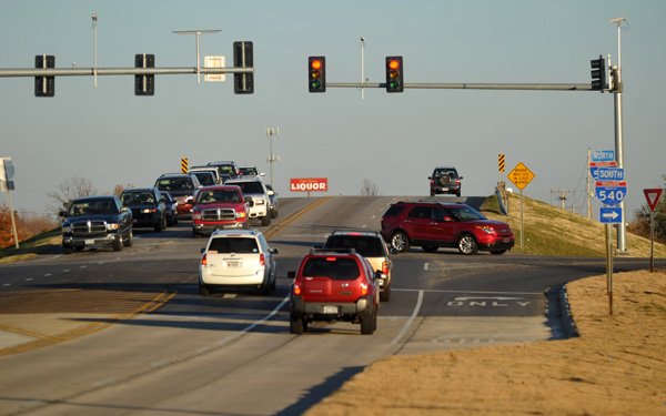 Traffic crosses at the intersection of Elm Springs Road and Interstate 540 in Springdale on Tuesday afternoon. Springdale is considering improving the intersection in the near future.