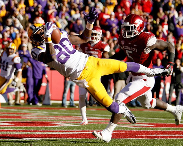 NWA Media/JASON IVESTER -- LSU wide receiver Jarvis Landry makes a catch for a touchdown in front of Arkansas linebacker Otha Peters during the second quarter on Friday, Nov. 23, 2012, at Donald W. Reynolds Razorback Stadium in Fayetteville.