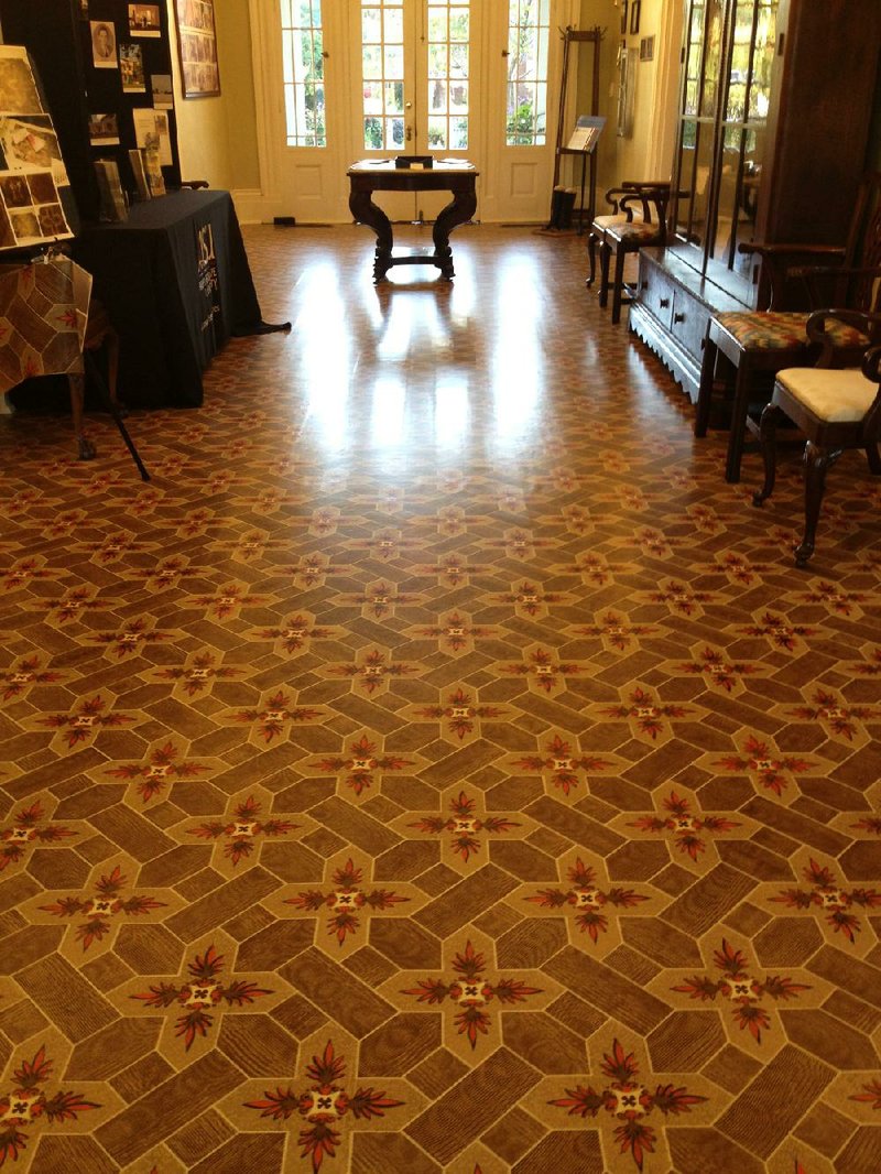 A hand-painted reproduction of a historic floor cloth, which Riley May of Columbia, Tenn., spent months crafting, now graces the central hallway of the Little Rock Visitor Information Center in historic Curran Hall. 