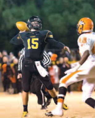 Cooper Winters, Prairie Grove quarterback, throws Friday during the Class 4A playoff game against Nashville at Tiger Stadium in Prairie Grove. 