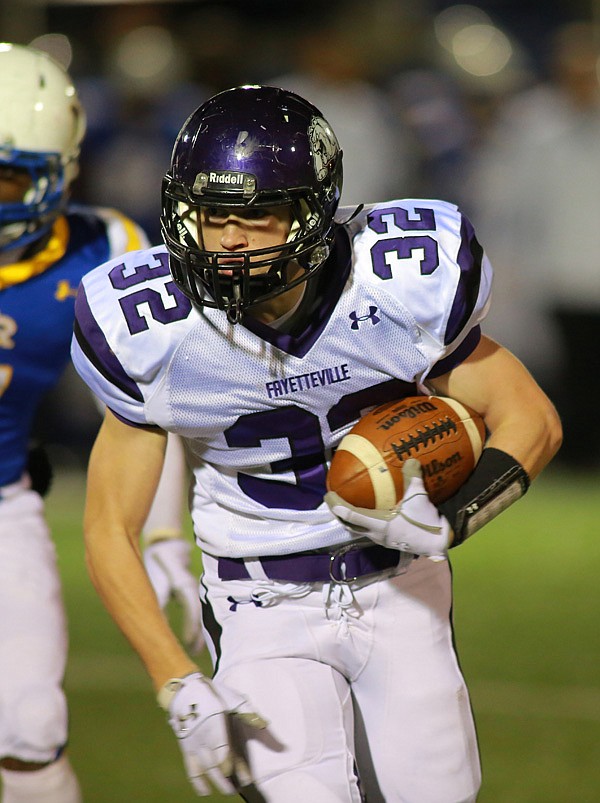 Cole Harris, Fayetteville, runs for a touchdown Friday in the first half against North Little Rock. 
