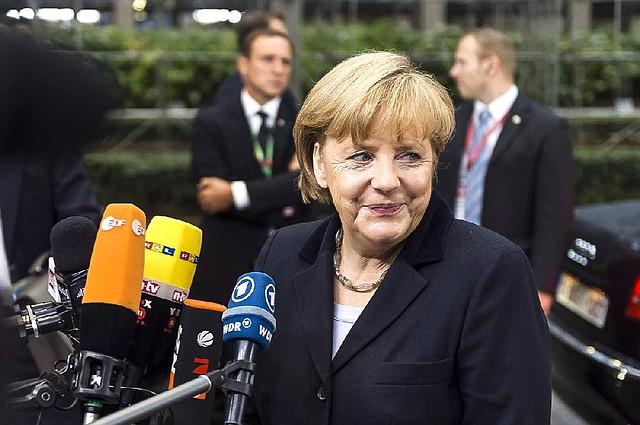 Angela Merkel, Germany’s chancellor, speaks to reporters Friday before a meeting of European Union leaders in Brussels. 