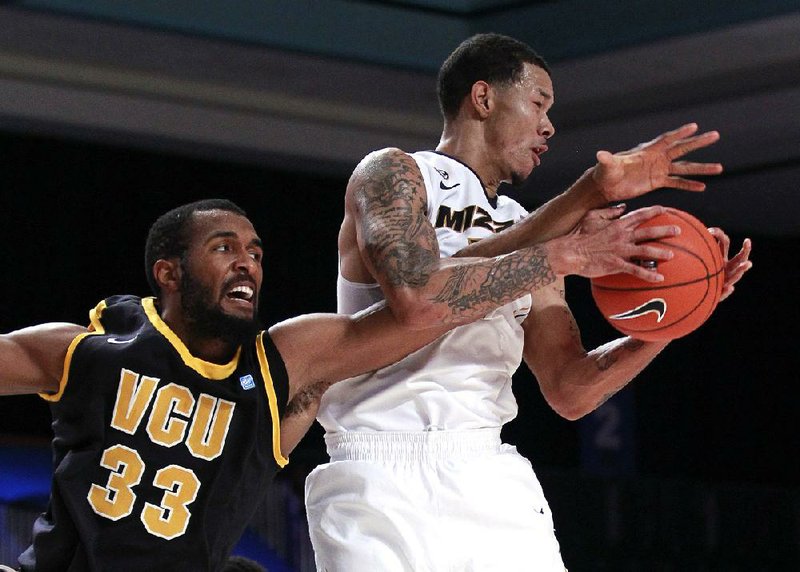 Missouri guard Negus Webster-Chan (14) grabs a rebound in front of Virginia Commonwealth center D.J. Haley (33) during the first half of Saturday’s game at the Battle 4 Atlantis tournament in Paradise Island, Bahamas. Webster-Chan finished with 12 points and Missouri won 68-65. 