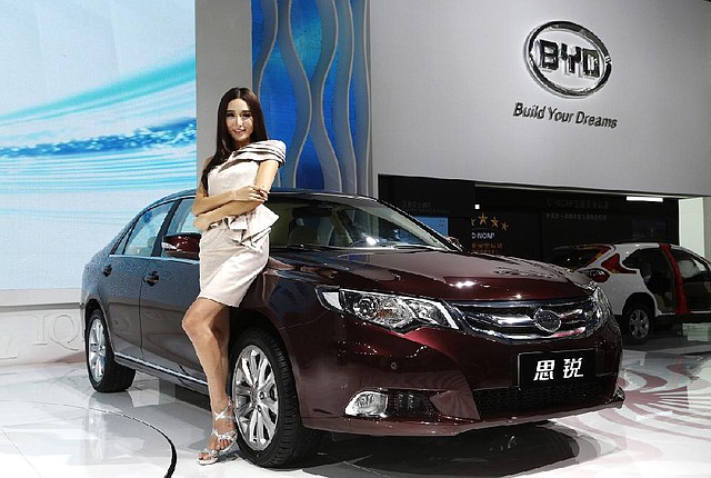 A model poses with a BYD Co. Si Rui midsize sedan Thursday at the Guangzhou 2012 Auto Show in China. 