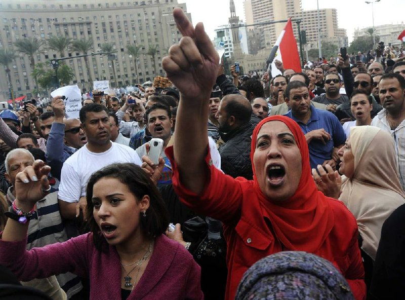 Egyptian protesters mass Friday in Tahrir Square in Cairo, a day after President Mohammed Morsi granted himself sweeping new powers that raise fears of a dictatorship. 