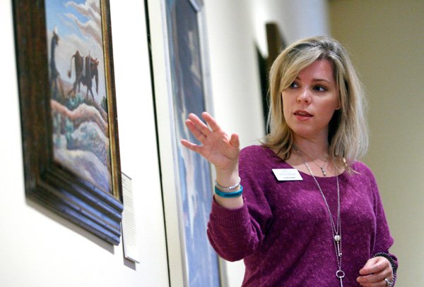 Laura Marie Rivera leads a discussion with fifth-graders on the painting “Ploughing it Under” by Thomas Hart Benton at Crystal Bridges in Bentonville. 