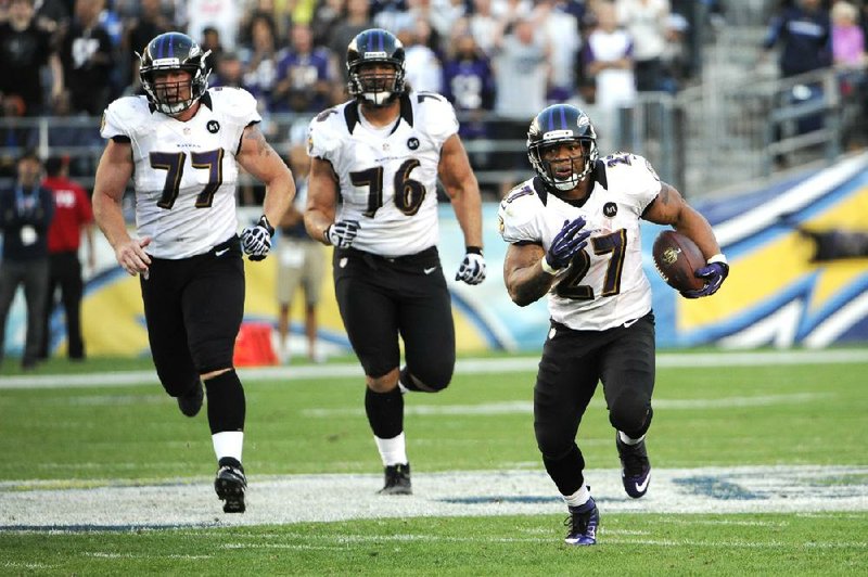 Baltimore Ravens running back Ray Rice (right) set up the Ravens’ game-tying field goal with a 30-yard run against the San Diego Chargers in the fourth quarter Sunday in San Diego. 