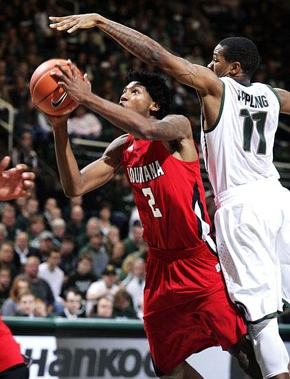 Louisiana-Lafayette guard Elfrid Payton (2) shoots against Michigan State guard Keith Appling (11) during the first half of Sunday’s game in East Lansing, Mich. Payton led Louisiana-Lafayette with 20 points, while Appling had 19 for Michigan State. Michigan State won 63-60. 
