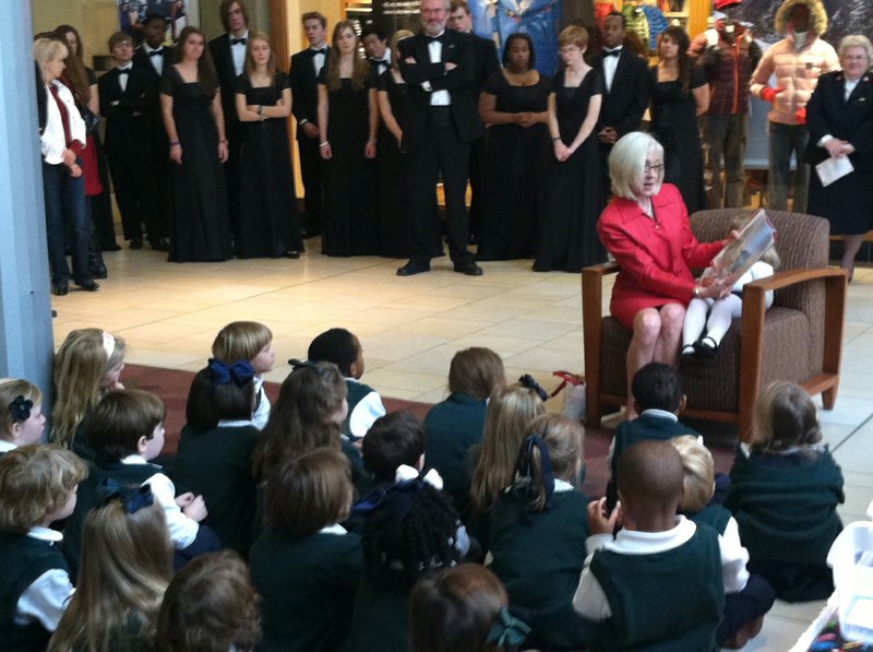 Arkansas first lady Ginger Beebe reads a Christmas story to children from Episcopal Collegiate School on Monday before the ribbon cutting ceremony for the 2012 Salvation Army Angel Tree at Park Plaza mall. 