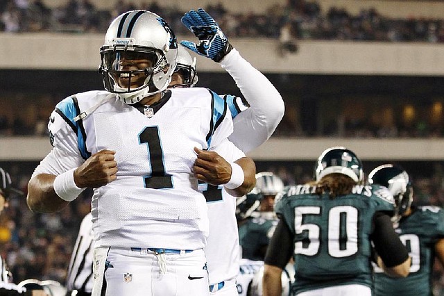 Carolina quarterback Cam Newton celebrates after scoring a touchdown in the second half of the Panthers’ 30-22 victory over the Philadelphia Eagles on Monday. 