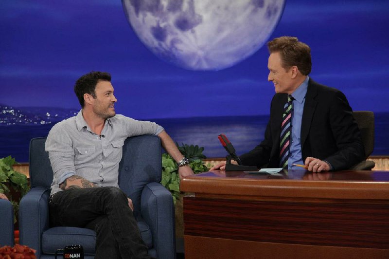 Late-night host Conan O’Brien (right), seen here with recent guest Brian Austin Green, is defensive of cable television where his show, Conan, airs on TBS. 
