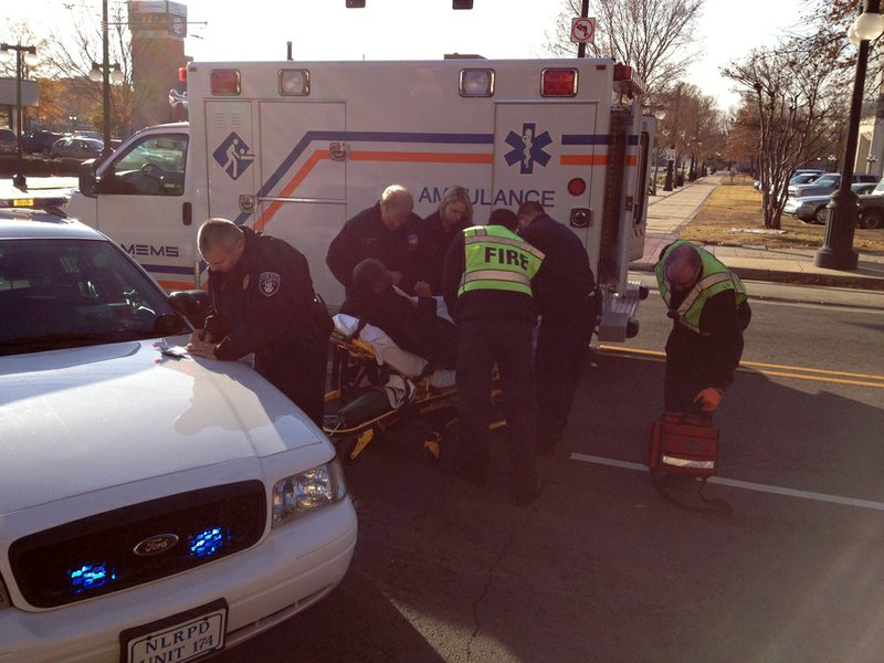 Police respond to where a pedestrian was hit by a car at Broadway and Main streets in North Little Rock.