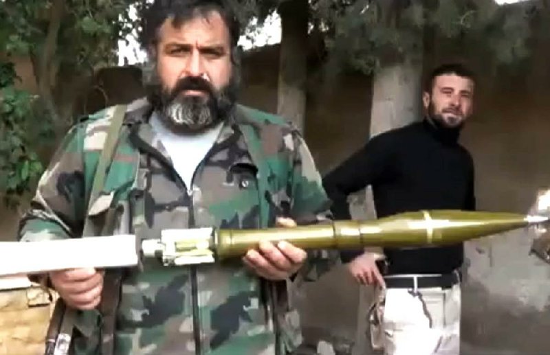 The Union of Syria’s Victory Battalions prepare a rocket-propelled grenade in Aleppo, Syria, on Monday, in this image taken from video obtained from the Ugarit News, which has been authenticated on the basis of its contents and other AP reporting. 