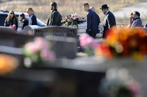 Relatives carry the casket of 6-year-old Jersey Bridgeman on Tuesday to her gravesite at Bentonville Cemetery. More than 200 people attended Jersey’s funeral at Rollins Funeral Home in Rogers. 