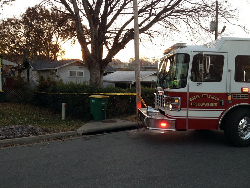 Fire officials respond to a fatal house fire Wednesday morning, Nov. 28, 2012, at 4500 Gum St. in North Little Rock.