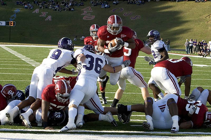 Kevin Nichols scores a touchdown for the Reddies during the Battle of the Ravine at Henderson State University on Nov. 10 against Ouachita Baptist University.