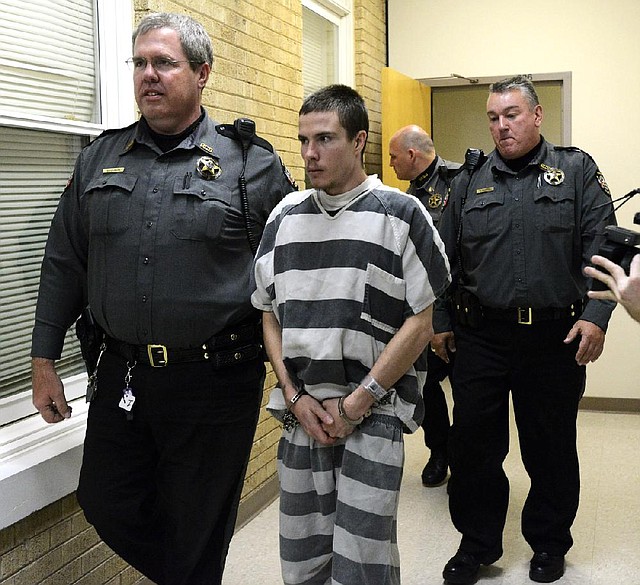 STAFF PHOTO MARC F. HENNING
Zachary Holly, 28, of Bentonville is escorted by Benton County Sheriff's Deputies into Circuit Judge Robin Green's courtroom Wednesday, Nov. 28, 2012, for his probable cause and bond hearing at the Benton County Courthouse in Bentonville.
