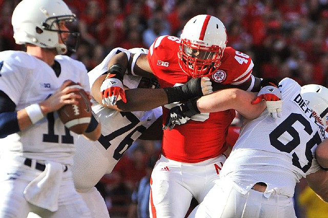 Nebraska defensive end Eric Martin (center) will have to step up for the Cornhuskers against Wisconsin on Saturday because of an injury to defensive tackle Baker Steinkuhler. 