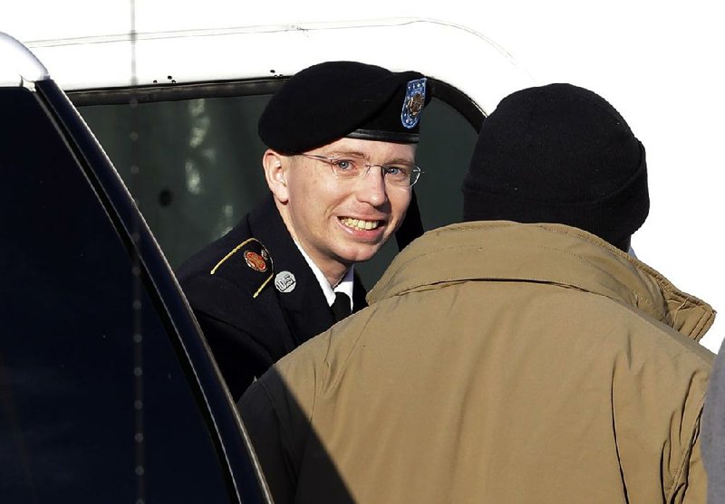 Army Pfc. Bradley Manning exits a security vehicle Wednesday as he is escorted into a courthouse in Fort Meade, Md., for a pretrial hearing. 