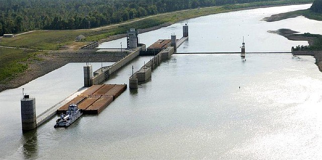 A towboat and barges enter the lock at Montgomery Point Lock and Dam in eastern Arkansas in this photo provided by the U.S. Army Corps of Engineers. 