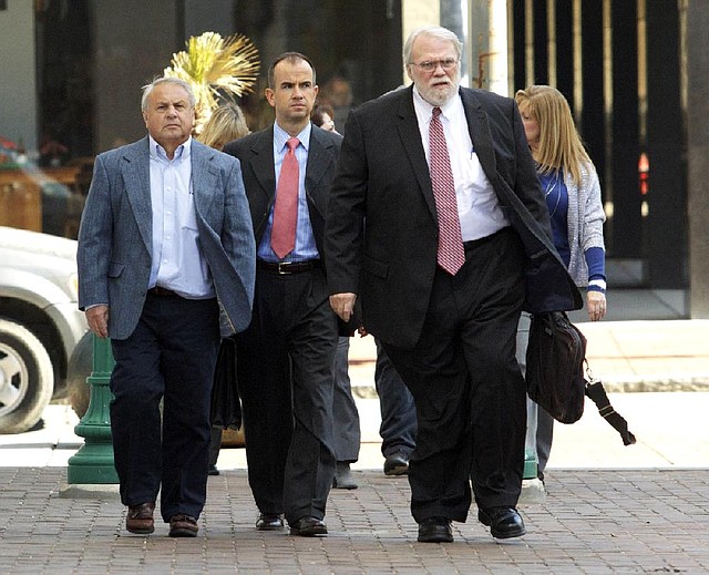 Donald Vidrine (left), a BP well site leader who worked on the Deepwater Horizon oil rig, arrives with his legal team at federal court in New Orleans on Wednesday for his arraignment on manslaughter charges. 