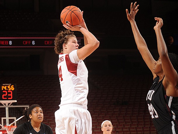 Arkansas senior post Sarah Watkins, center, takes a shot in the lane as Texas Southern junior center Crystal Anyiam defends during the first half of play Thursday, Nov. 29, 2012, in Bud Walton Arena.