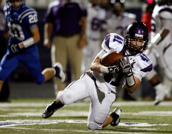 Jase Rapert, a Fayetteville junior, makes a reception against Rogers High during on Oct. 12 at Mountie Stadium in Rogers. 