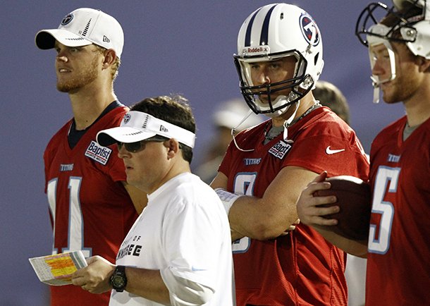 Tennessee Titans offensive coordinator Dowell Loggains, front, watches the quarterbacks during NFL football camp in Nashville, Tenn. (AP Photo/Wade Payne, File)