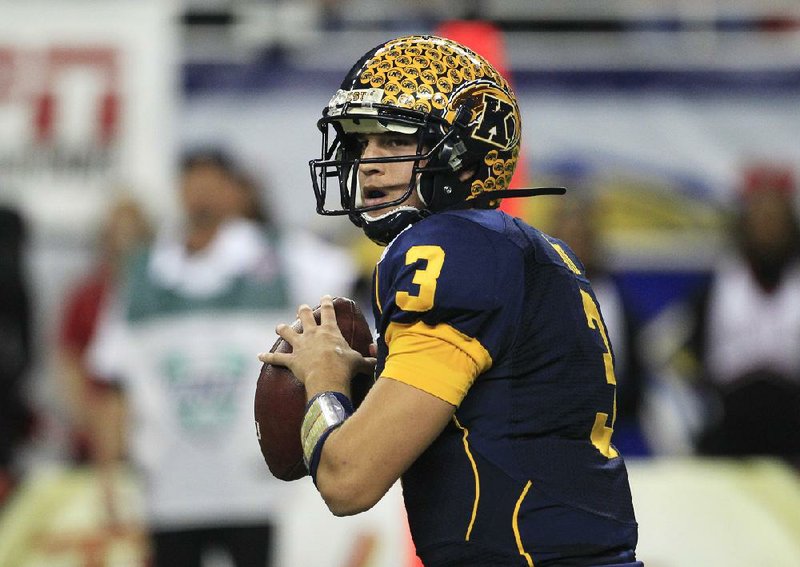 Kent State quarterback Spencer Keith (3) completed 15 of 36 passes for 190 yards and was intercepted twice in the Golden Flashes’ 44-37 double overtime loss to Northern Illinois on Friday night in the Mid-American Conference Championship Game. 