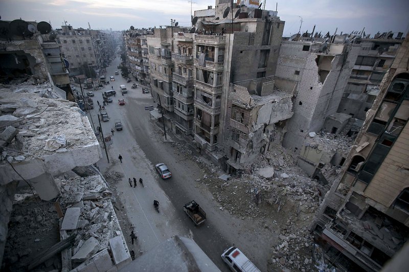 Destroyed buildings, including Dar Al-Shifa hospital, are seen on Sa'ar street after airstrikes targeted the area in Aleppo, Syria, on Thursday, Nov. 29, 2012.