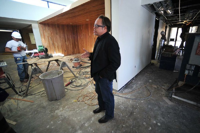 Marlon Blackwell assesses the construction going on Thursday inside the office space at 1188 N. Woolsey Ave. in Fayetteville, which will house the Northwest Arkansas Free Health Center. 
