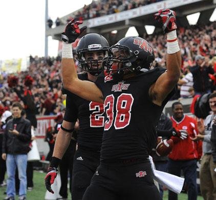 Arkansas State wide receiver Rocky Hayes (38) celebrates after scoring on a 12-yard touchdown run during Saturday’s 45-0 victory over Middle Tennessee at Liberty Bank Stadium in Jonesboro. The Red Wolves next face Kent State in the GoDaddy.com Bowl. 