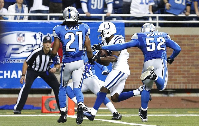 Indianapolis Colts receiver Donnie Avery (center) scored the gamewinning touchdown with no time remaining in the fourth quarter Sunday against the Detroit Lions at Ford Field in Detroit. The Colts beat the Lions 35-33. 