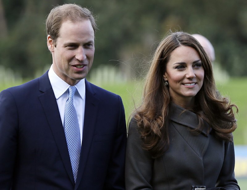 Britain's Prince William, left, and his wife, Kate, the Duchess of Cambridge, visit a football training pitch at St George's Park near Burton Upon Trent in Staffordshire, England, in this file photo dated Tuesday, Oct. 9, 2012. 