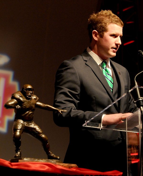 Matt McGloin, senior quarterback from Penn State, accepts the Brandon Burlsworth Trophy on Monday during a ceremony at the Northwest Arkansas Convention Center in Springdale. The other finalists were David Quessenberry, senior tackle at San Jose State University, and Jordan Kovacs, senior safety at the University of Michigan. The trophy is awarded annually to the top walk-on student athlete in Division I football. 