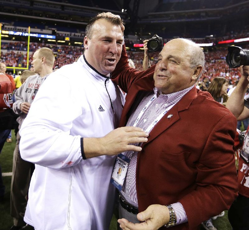 Wisconsin coach Bret Bielema, left, celebrates with athletic director Barry Alvarez after Wisconsin defeated Nebraska 70-31 to win the Big Ten dhampionship NCAA college football game Saturday, Dec. 1, 2012, in Indianapolis. (AP Photo/Darron Cummings)