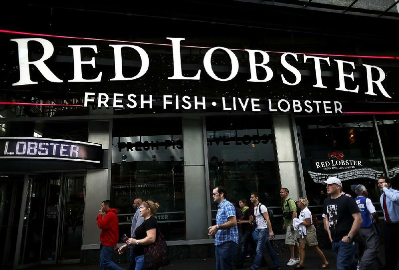 Pedestrians in New York pass a Red Lobster restaurant in September. Red Lobster owner Darden Restaurants Inc. expects revenue at Olive Garden, Red Lobster and LongHorn Steakhouse locations open at least a year to be down about 2.7 percent. 